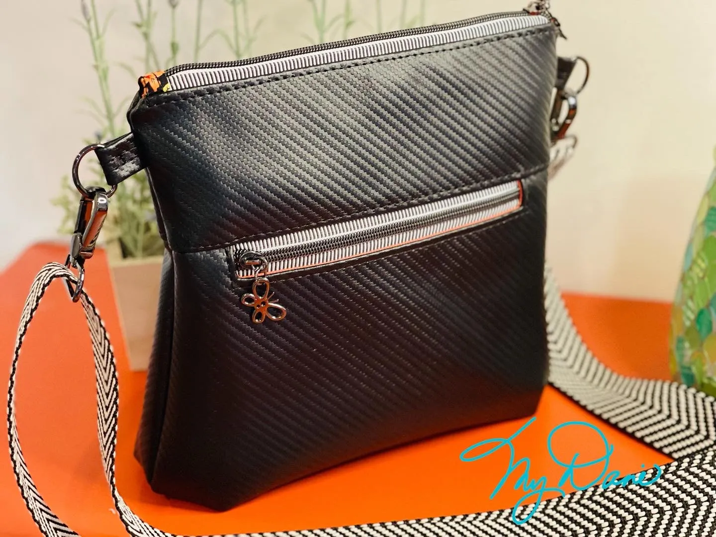 The Ayla Crossbody Bag in Bright Floral and Textured Black.