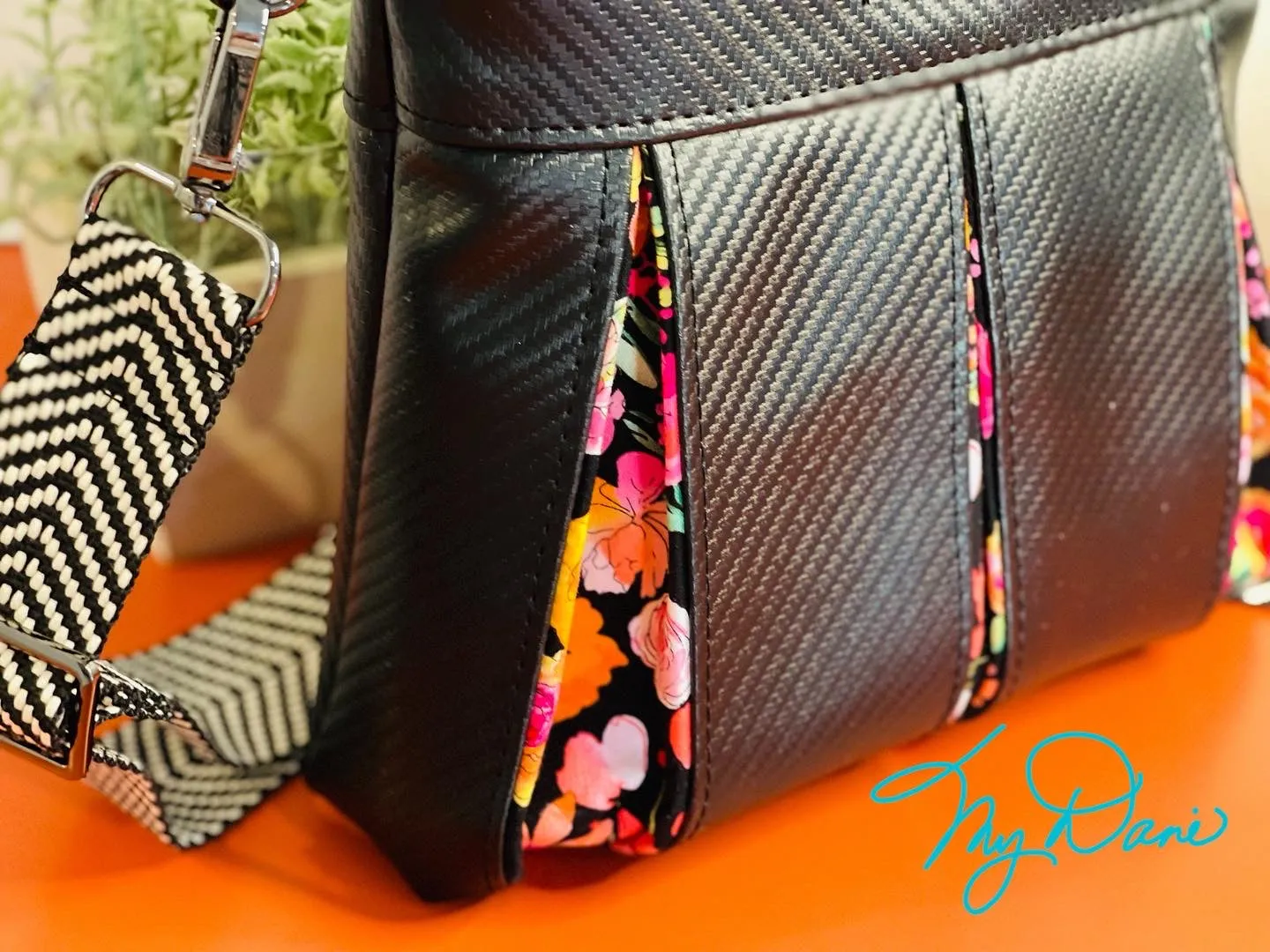 The Ayla Crossbody Bag in Bright Floral and Textured Black.