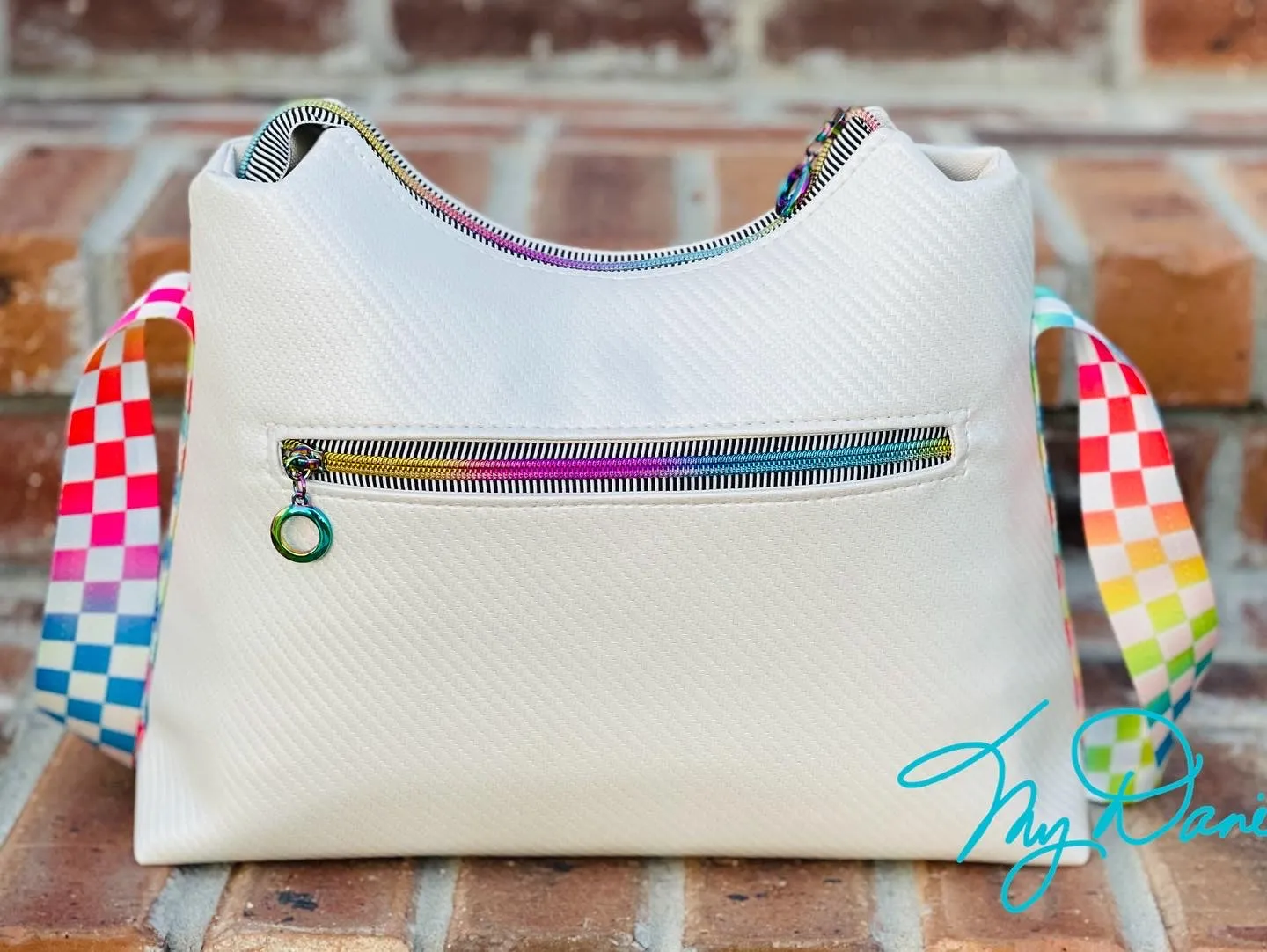 The Beanie Baguette Handbag in textured off white w/racing stripes webbing