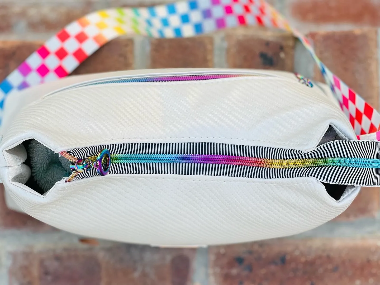 The Beanie Baguette Handbag in textured off white w/racing stripes webbing